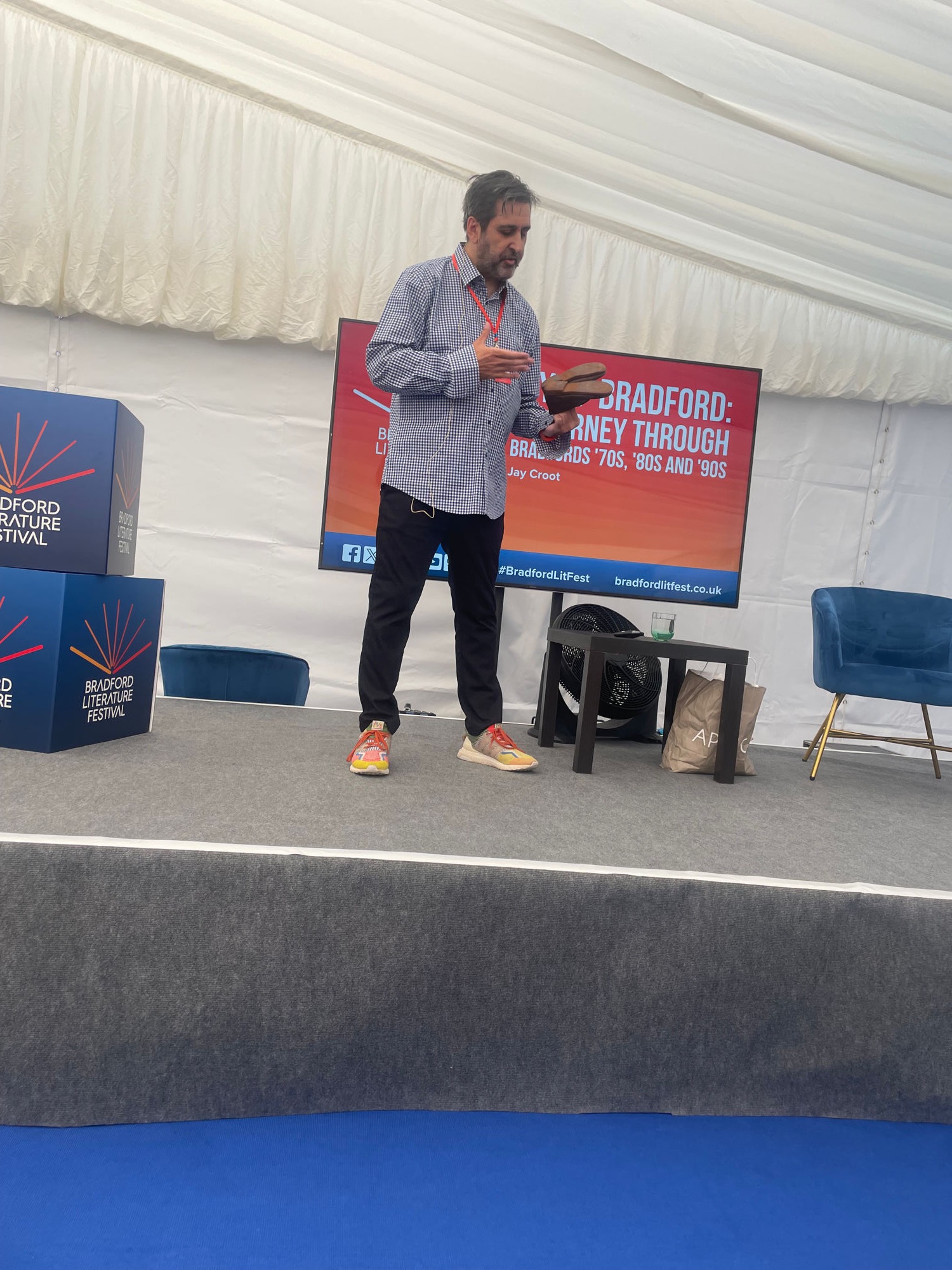 Jason Croot speaking on stage at Bradford Literature Festival